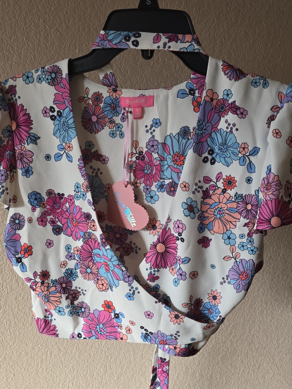 Dolls Kill Pink  'Sugar Thrillz' Tag with Pastel Floral Backdrop